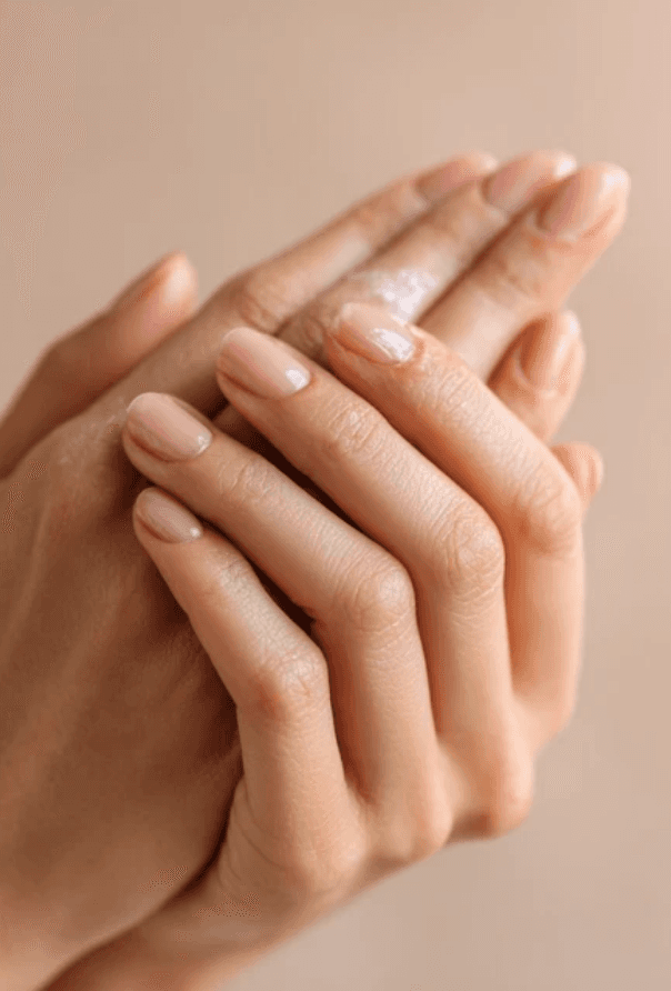 Smiling skincare user